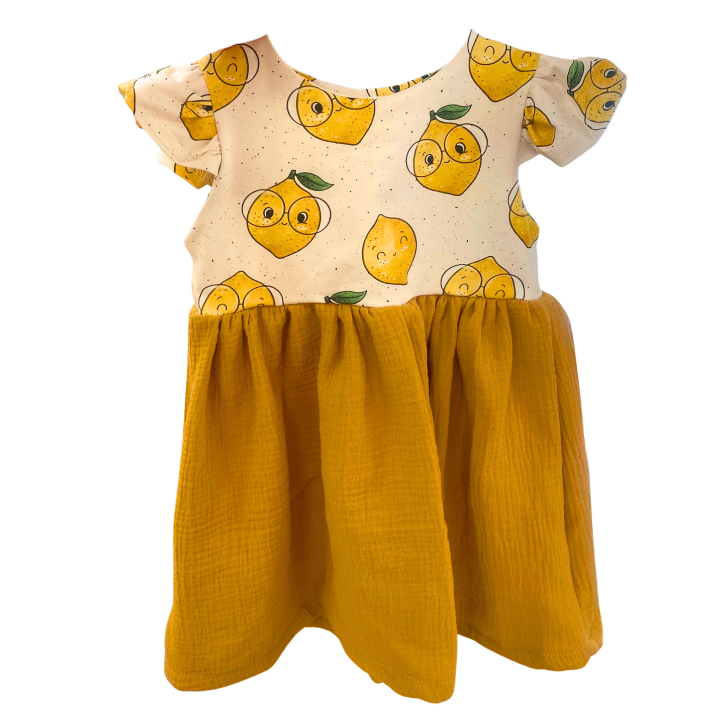 Handgemachtes Sommerkleid für Kinder aus Bio-Musselin mit Zitronenmotiv